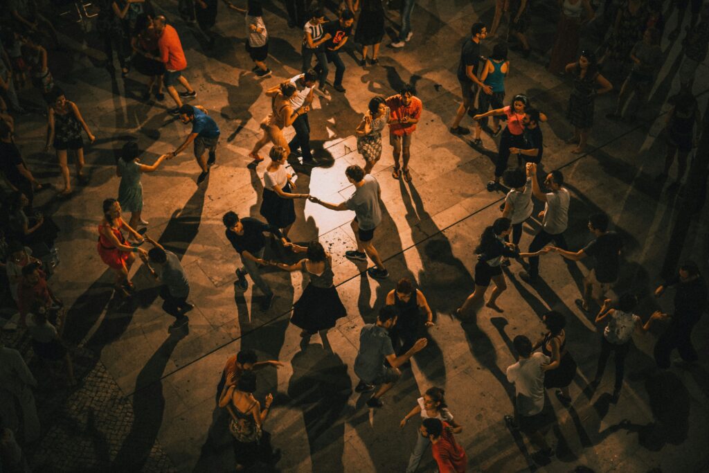 The vibrant nightlife of couples salsa dancing on 5th Street in Playa del Carmen.