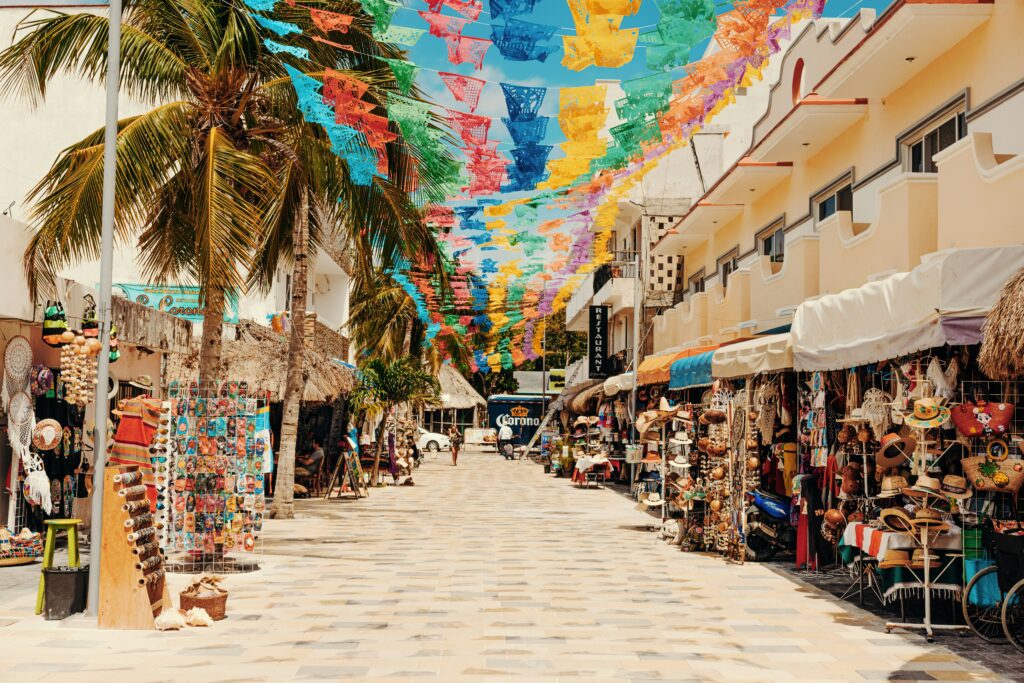 The unique and colorful 5th Avenue in Playa del Carmen is lined with boutiques, artisan markets, and upscale stores