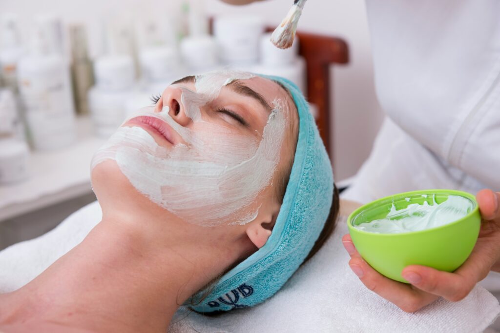 A lady enjoying a facial at the rejuvenating spa on board a Crystal Cruise. 