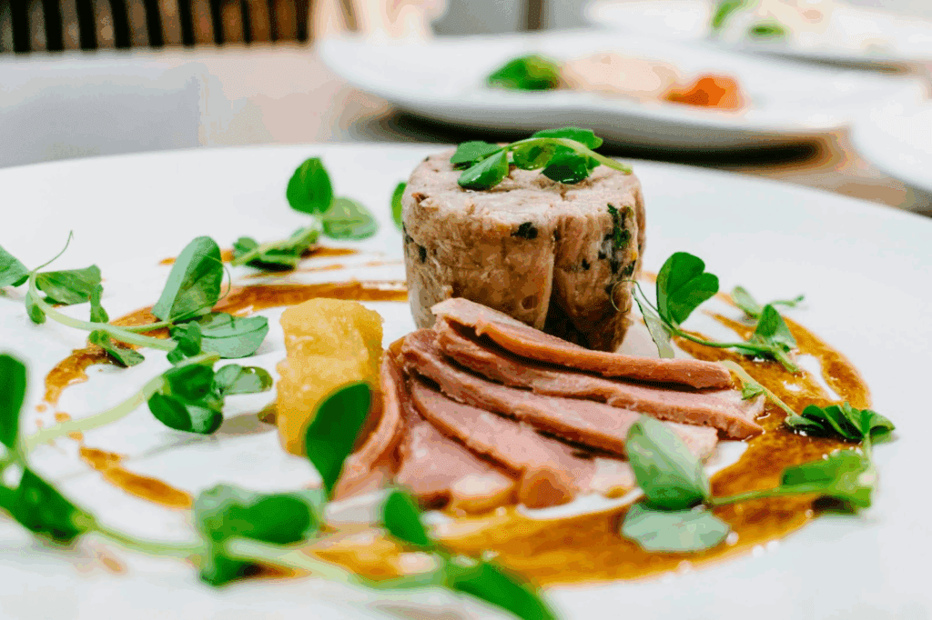 A beautifully plated gourmet dish pairs great with wine onboard Oceania.