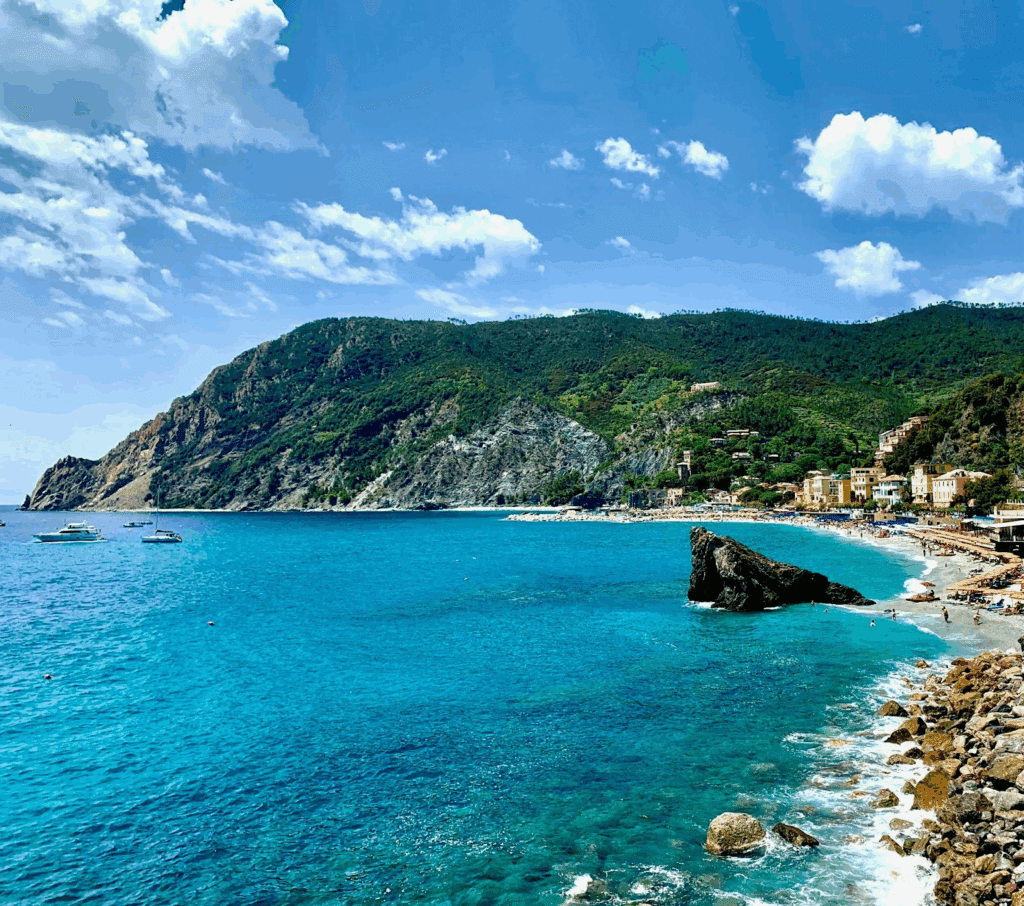 A panoramic shot of a sleek Oceania ship gliding through the Mediterranean Coast. 